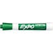 A close-up of a green Expo dry erase marker with a white cap.