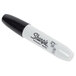 A Sharpie black chisel tip permanent marker with a black cap.