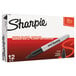A box of 12 Sharpie black permanent markers.