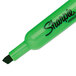 A close up of a green Sharpie highlighter.