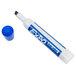 A close up of a blue Expo dry erase marker with a cap on a white surface.