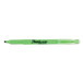 A close up of a Sharpie fluorescent green highlighter with the word "Sharpie" on it.