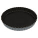 A black Matfer Bourgeat fluted quiche pan with a black rim.