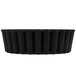 A black rectangular Matfer Bourgeat fluted tartlet pan with a white border.