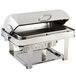 A Bon Chef stainless steel rectangular roll top chafer with chrome accents on a counter.