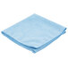 A blue Carlisle microfiber cleaning cloth folded on a white background.
