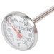 A close-up of a Taylor pocket probe thermometer with a red and white handle.