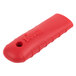 A red silicone handle holder with a hole and text that says "Lodge Pro-Logic"