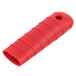 A red silicone handle holder with a hole for a Lodge pan handle.