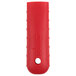 A red silicone handle holder with a white circle on it.