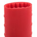 A red silicone cylinder with a hole in the middle.