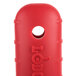 A red silicone handle holder with a hole in it.