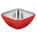 A fire engine red Vollrath square metal bowl with a stainless steel handle.