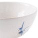 A close-up of a Thunder Group Blue Bamboo melamine soup bowl with a blue and white design.