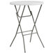 A Flash Furniture round white plastic folding table with metal legs.