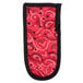A red bandana with black paisley pattern and trim on a Lodge handle.