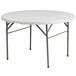 A Flash Furniture white round plastic folding table with metal legs.