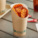 A Kraft EcoChoice paper cup filled with waffle fries.