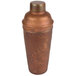 An American Metalcraft hammered antique copper cobbler cocktail shaker with a lid.