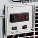 The thermostat control panel on a white Avantco countertop display freezer.