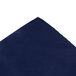 A navy blue cloth with a corner folded over.