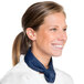 A woman wearing a navy blue Intedge chef neckerchief.