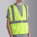 A person wearing a Cordova lime yellow high visibility safety vest.