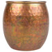 A close-up of an American Metalcraft Hammered Antique Copper Moscow Mule Tumbler.