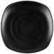 A black square plate with a circular rim.