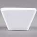 An American Metalcraft white square melamine sauce cup on a grey surface.