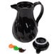 A black Choice thermal coffee carafe with a lid on a counter.