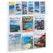 A Safco clear acrylic wall-mount magazine rack filled with magazines.