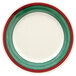 A white plate with a red and green rim.