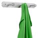 A green jacket hanging on a Safco aluminum coat hook.