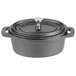 An American Metalcraft pre-seasoned mini cast iron oval Dutch oven with a lid.