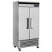 A stainless steel Turbo Air reach-in freezer with two solid doors and black handles.