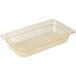 A Cambro amber plastic food pan with a lid on a counter.