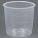 A clear plastic measuring cup with numbers.
