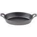 A black pre-seasoned cast iron oval casserole dish with two handles.