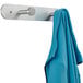 A blue towel hanging on a Safco Nail Head coat rack with two metal hooks.