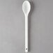 A white plastic Vollrath kitchen spoon with a handle.