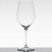 A close-up of a clear Spiegelau Bordeaux wine glass.
