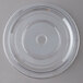 A clear plastic disc with a circular rim covering a plate.