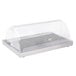 A clear plastic container with a clear lid on a Vollrath stainless steel cooling plate.