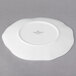 A white Villeroy & Boch bone porcelain plate with a circular design on it.