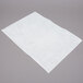 White FMP fryer oil filter paper on a gray surface.