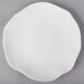 A white Villeroy & Boch bone porcelain plate with a small circular design.