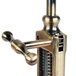 A close-up of a Franmara rack and pinion corkscrew with brass and metal parts.