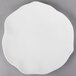 A white Villeroy & Boch bone porcelain flat plate with a small design on it.