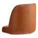 A Lancaster Table & Seating caramel brown vinyl bucket chair with a backrest.